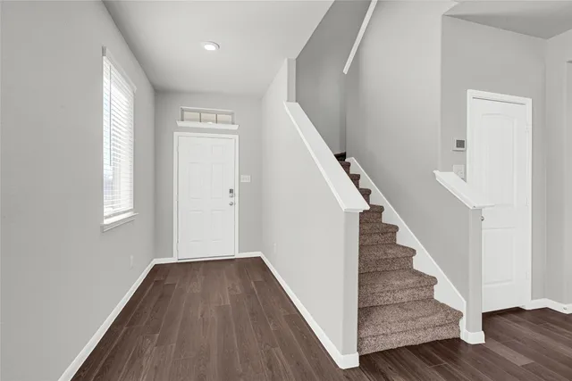 a view of entryway with wooden floor