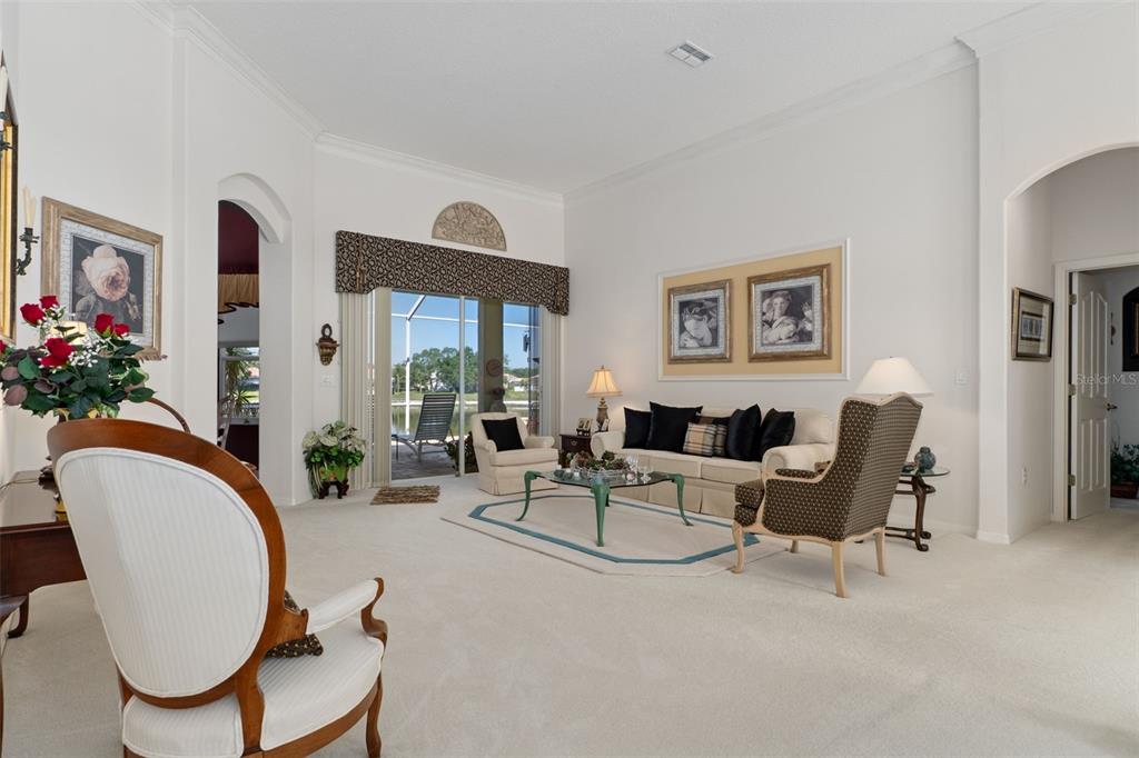 10081 Georgetown Court Weeki Wachee, FL 34613 - Photo 7 of 76 a living room with furniture potted plant and a large window