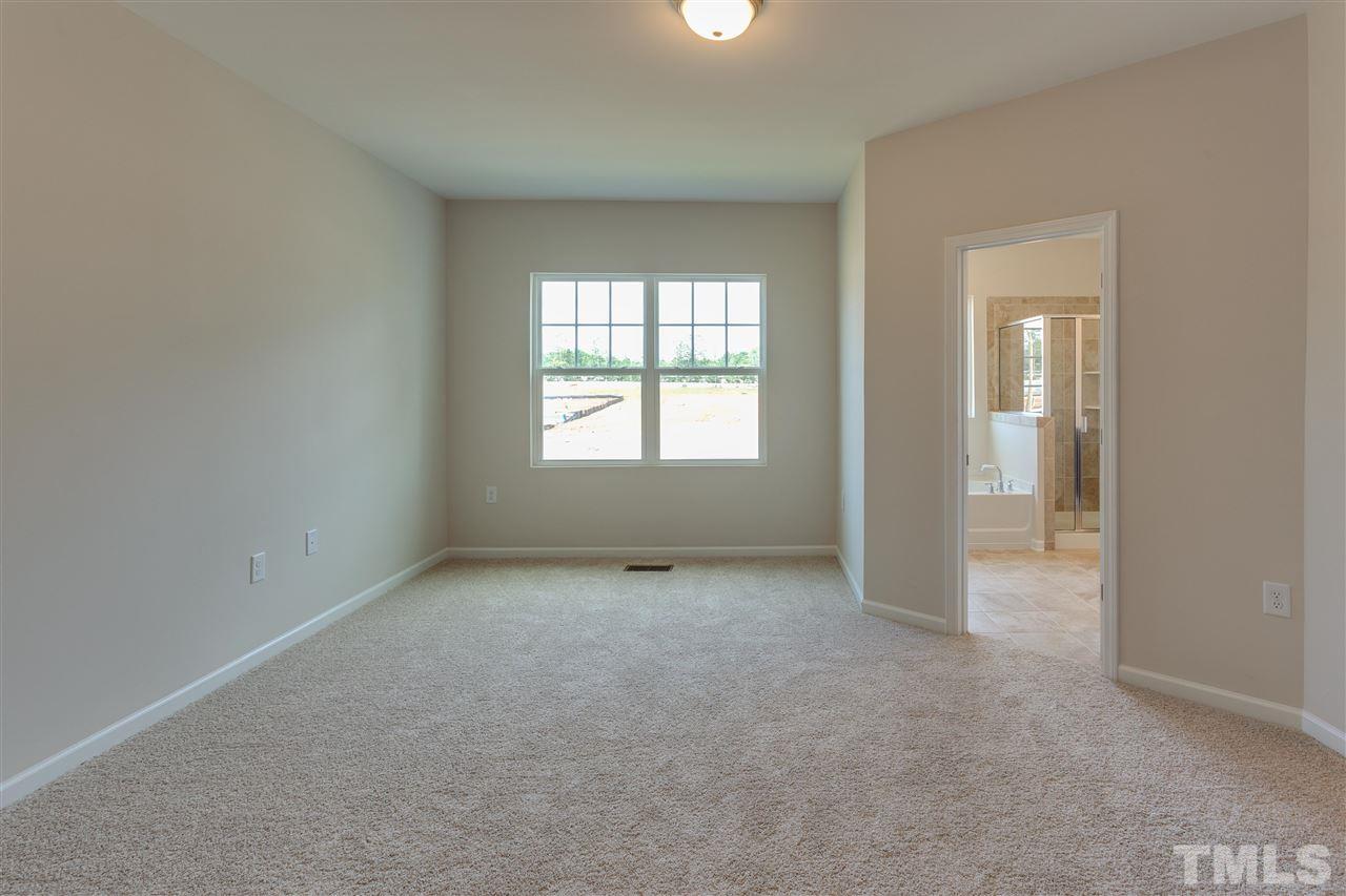 6004 Beale Loop, Unit 125 ABBEY Raleigh, NC 27616 - Photo 9 of 16 a view of an empty room with a window