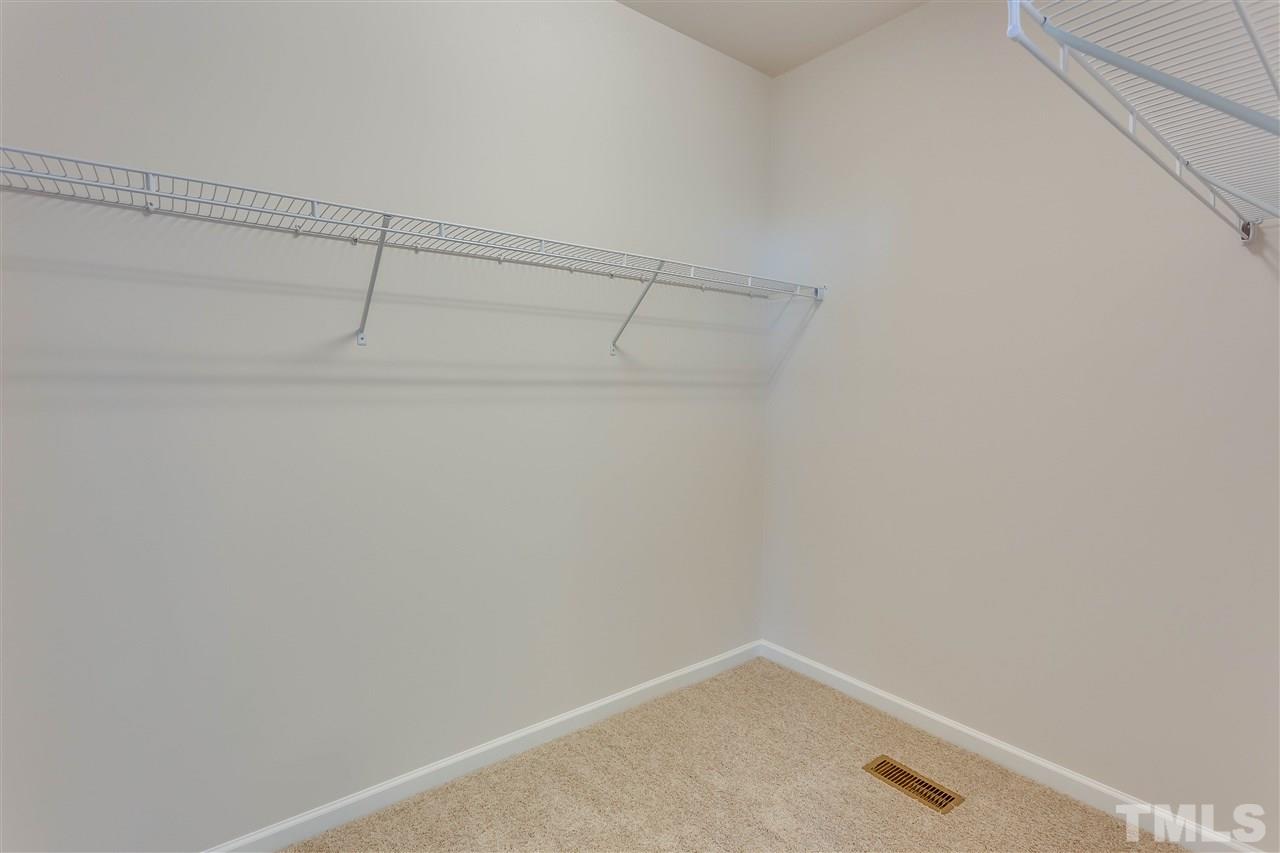 6004 Beale Loop, Unit 125 ABBEY Raleigh, NC 27616 - Photo 10 of 16 a view of a room with racks on the wall