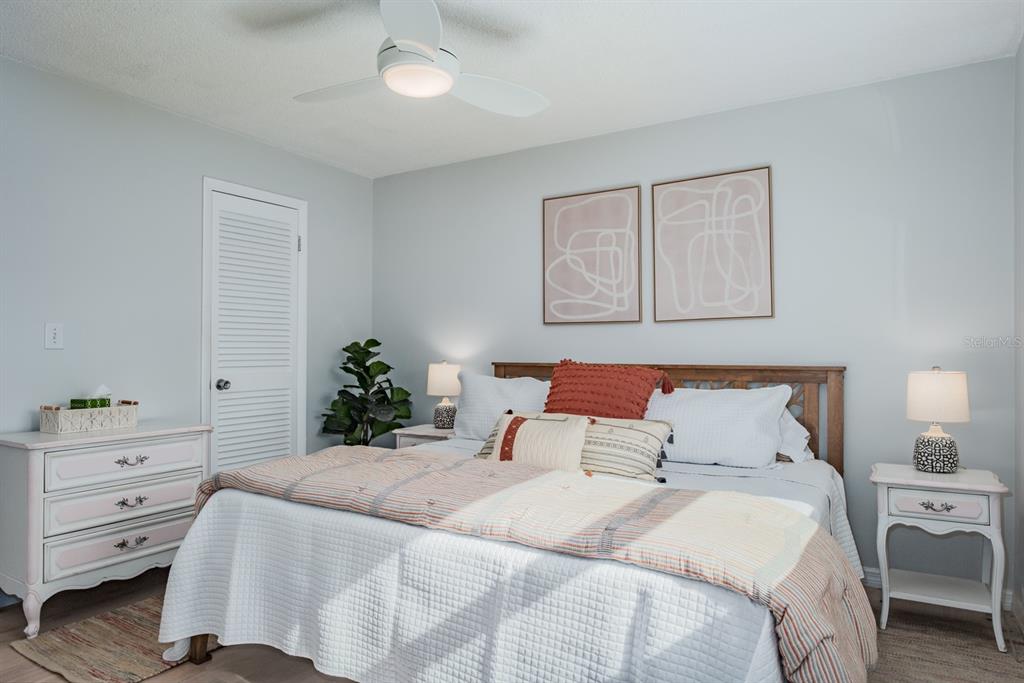 7151 Sunset Way, Unit 10 St. Pete Beach, FL 33706 - Photo 20 of 33 a bedroom with a bed and a dresser