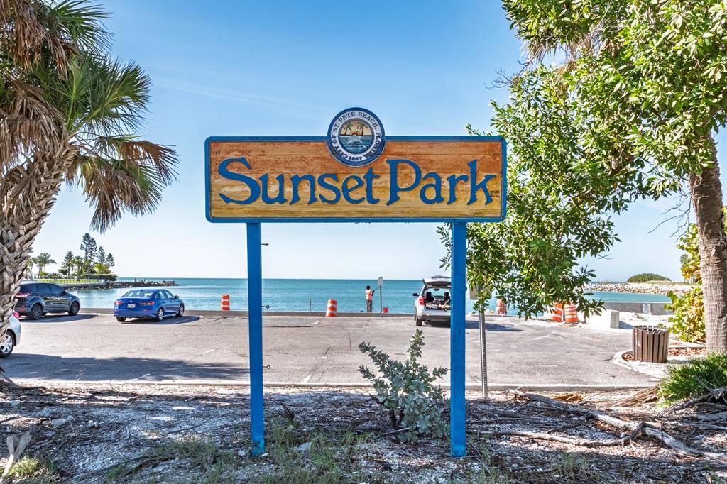 7151 Sunset Way, Unit 10 St. Pete Beach, FL 33706 - Photo 25 of 33 a street sign on a sidewalk next to a road