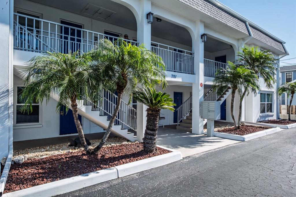 7151 Sunset Way, Unit 10 St. Pete Beach, FL 33706 - Photo 3 of 33 a plant in front of a house