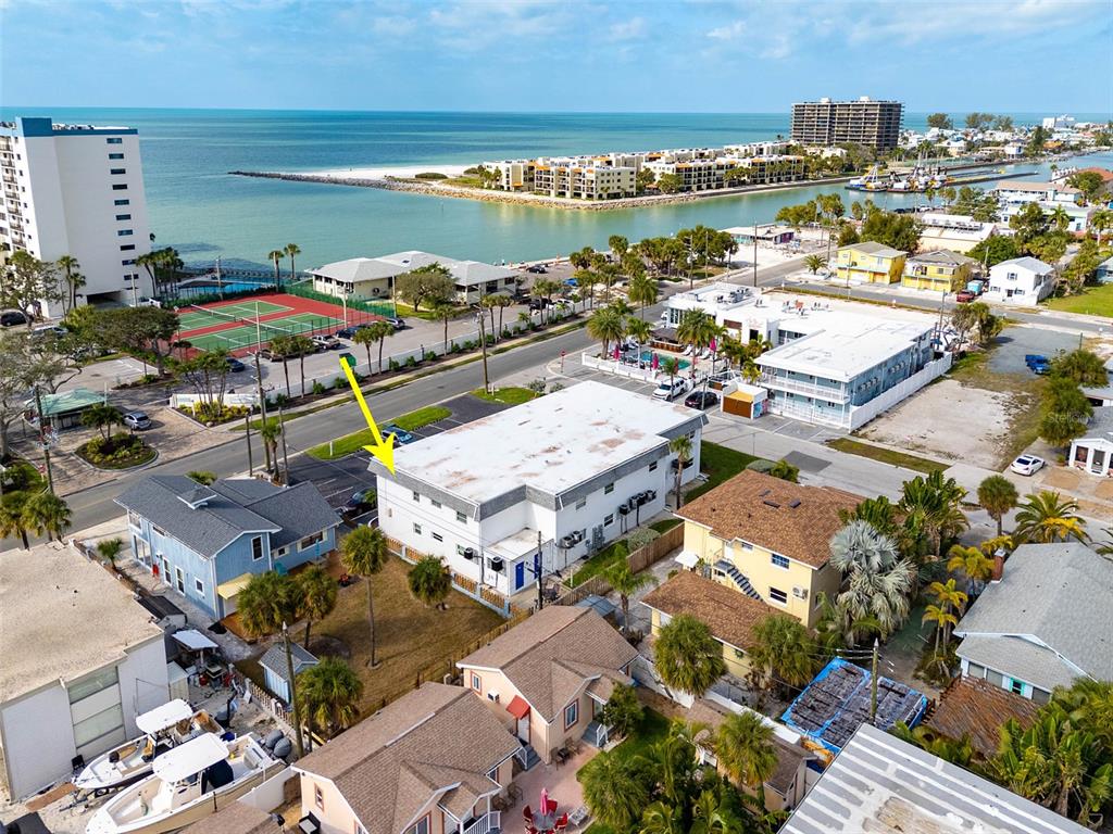 7151 Sunset Way, Unit 10 St. Pete Beach, FL 33706 - Photo 32 of 33 a view of a city with an ocean view