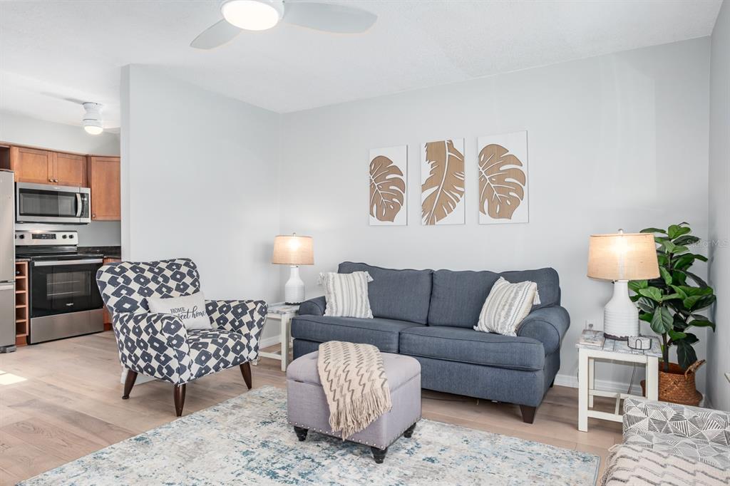 7151 Sunset Way, Unit 10 St. Pete Beach, FL 33706 - Photo 8 of 33 a living room with furniture and a couch