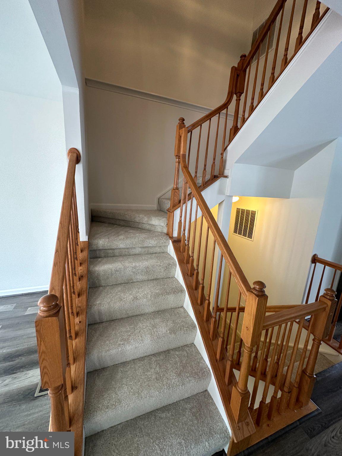 43395 Allisons Ridge Terrace Ashburn, VA 20148 - Photo 17 of 32 Inviting staircase with warm wood accents.