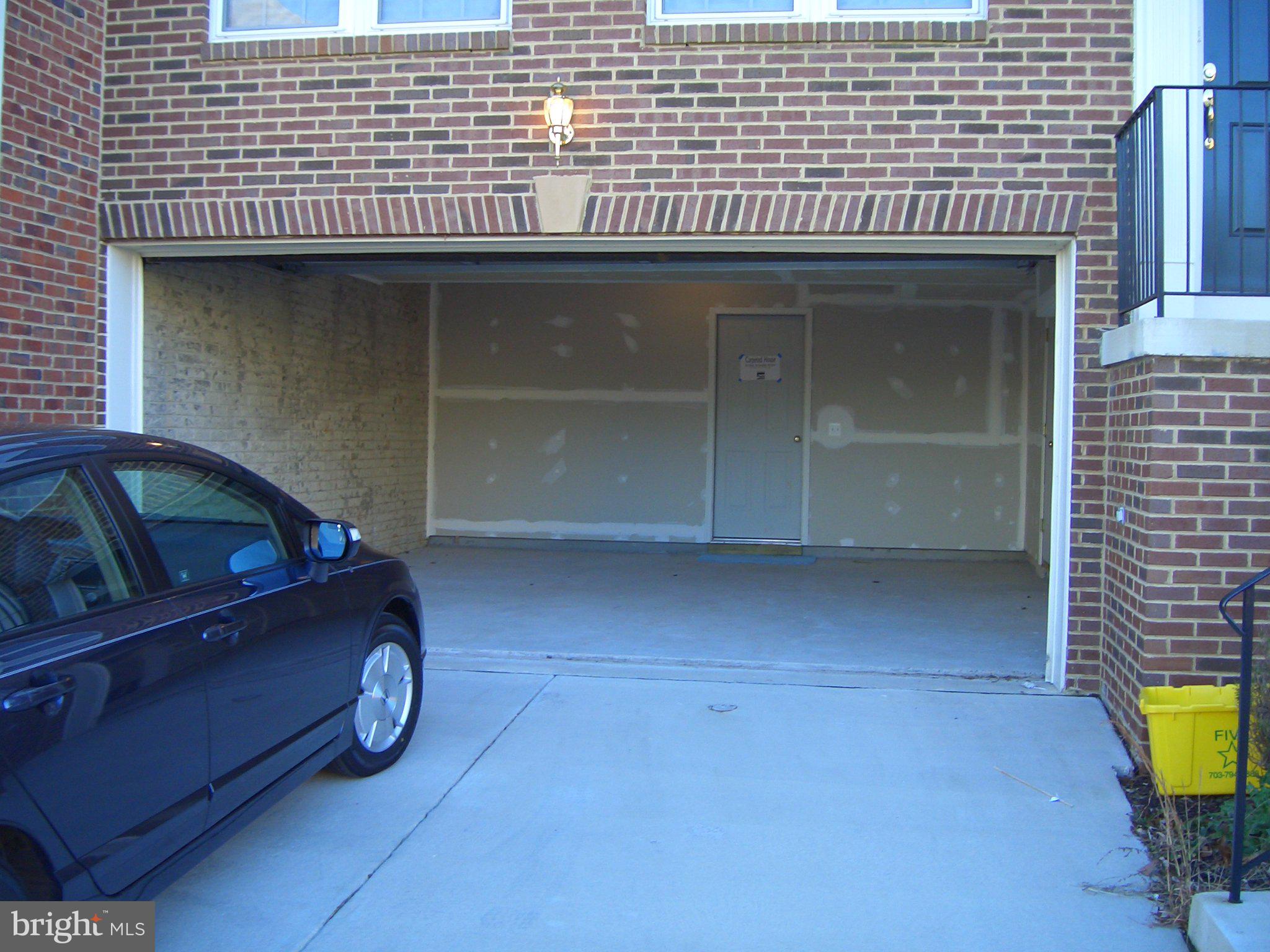 43395 Allisons Ridge Terrace Ashburn, VA 20148 - Photo 30 of 32 Spacious garage with modern appeal.