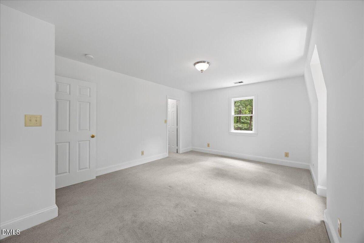 6516 Bakersfield Drive Raleigh, NC 27606 - Photo 41 of 59 an empty room with a window