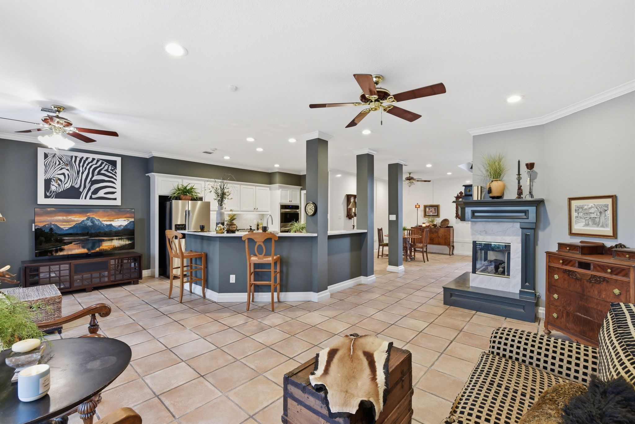 16322 Cranwood Drive Spring, TX 77379 - Photo 15 of 42 This spacious and stylish open-concept living area features a charming breakfast bar that connects the kitchen to the inviting living space, perfect for entertaining and everyday enjoyment.