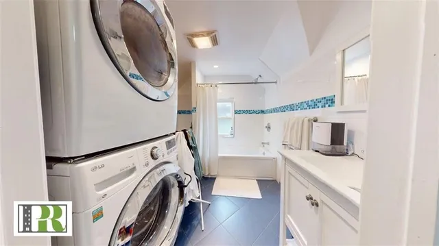a view of a kitchen with washer and dryer