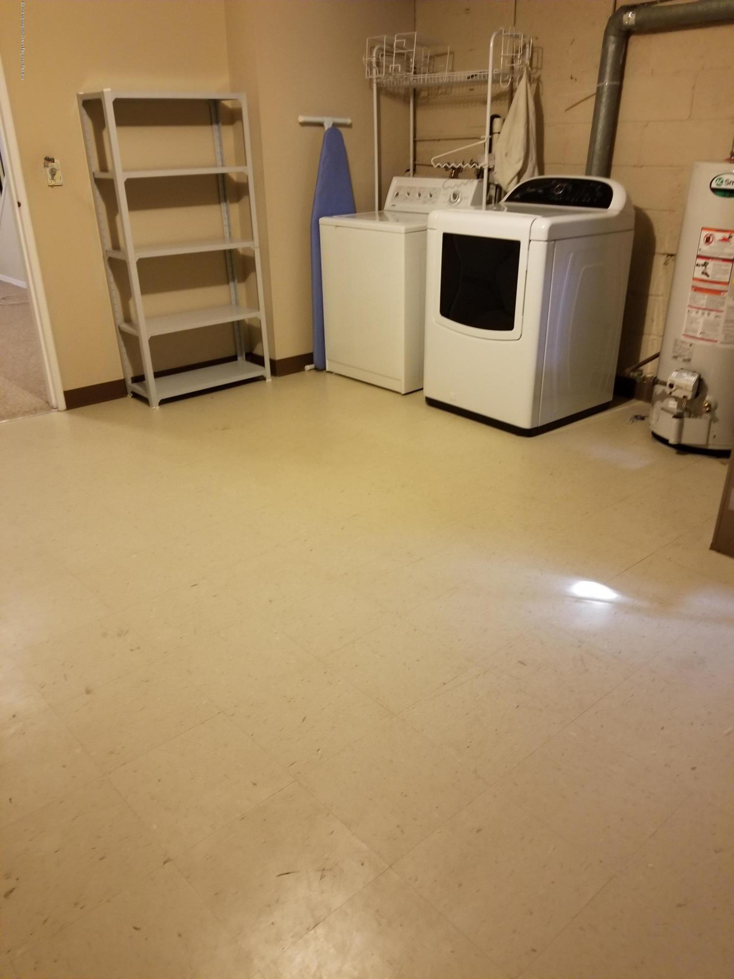 321 Spring Street, Unit 21 Red Bank, NJ 07701 - Photo 10 of 11 a view of a storage & utility room with a sink