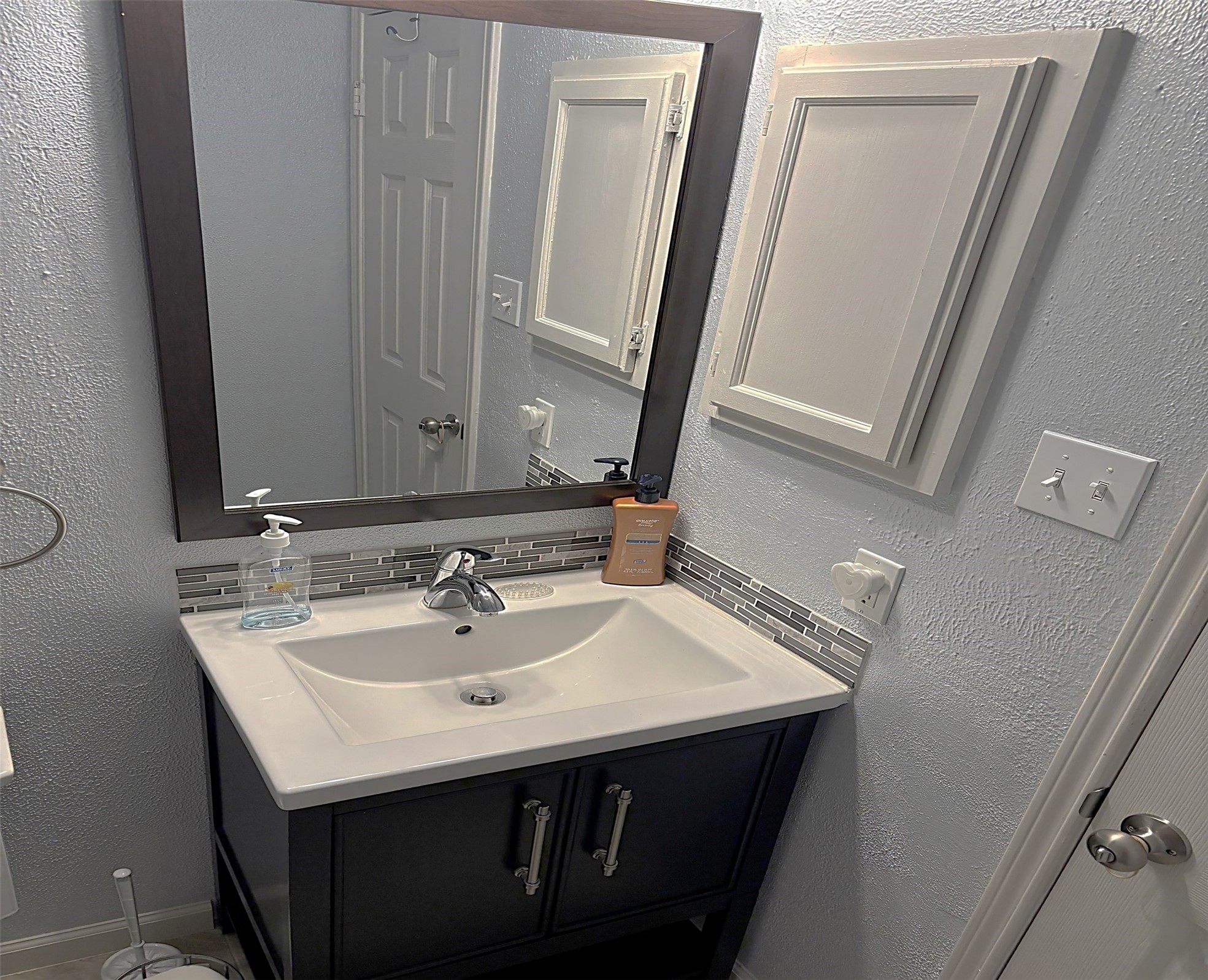 3207 Georgia Pine Drive Spring, TX 77373 - Photo 13 of 29 a bathroom with a sink and a mirror