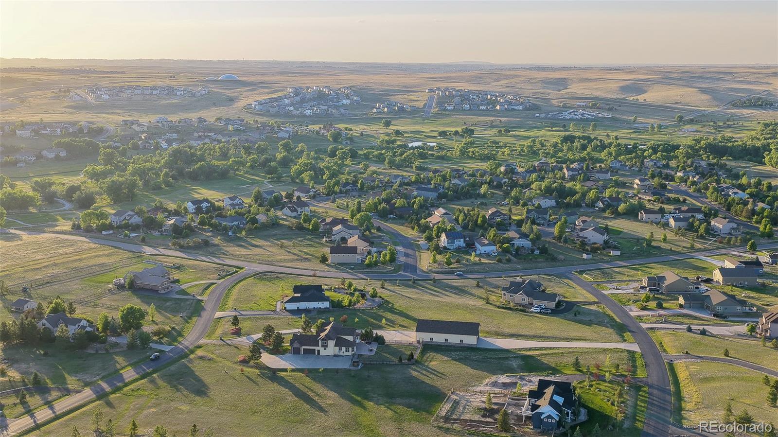 41865 East Muirfield Loop Elizabeth, CO 80107 - Photo 43 of 50 an aerial view of a city with mountains