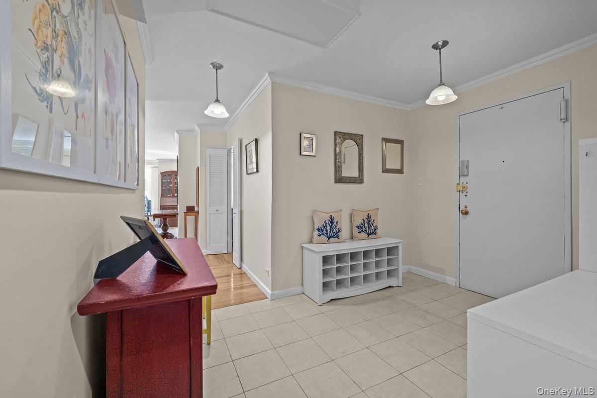 2500 Johnson Avenue North, Unit 2NP Bronx, NY 10463 - Photo 11 of 45 Entryway featuring ornamental molding and light tile patterned floors