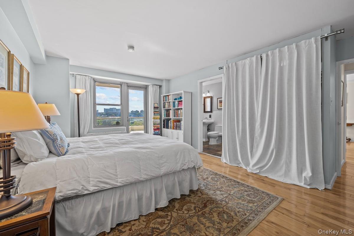 2500 Johnson Avenue North, Unit 2NP Bronx, NY 10463 - Photo 18 of 45 Bedroom with light wood-style flooring and ensuite bath