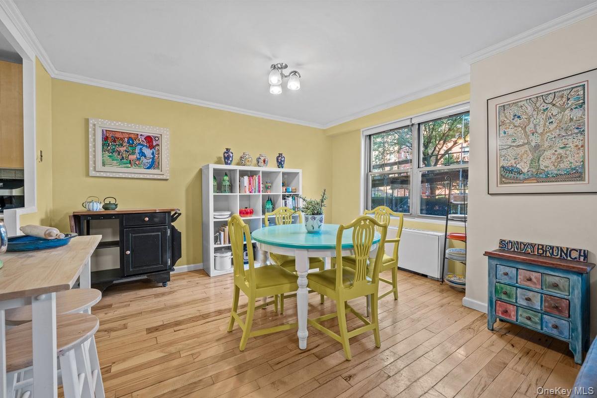 2500 Johnson Avenue North, Unit 2NP Bronx, NY 10463 - Photo 9 of 45 Dining area featuring ornamental molding and light wood-type flooring