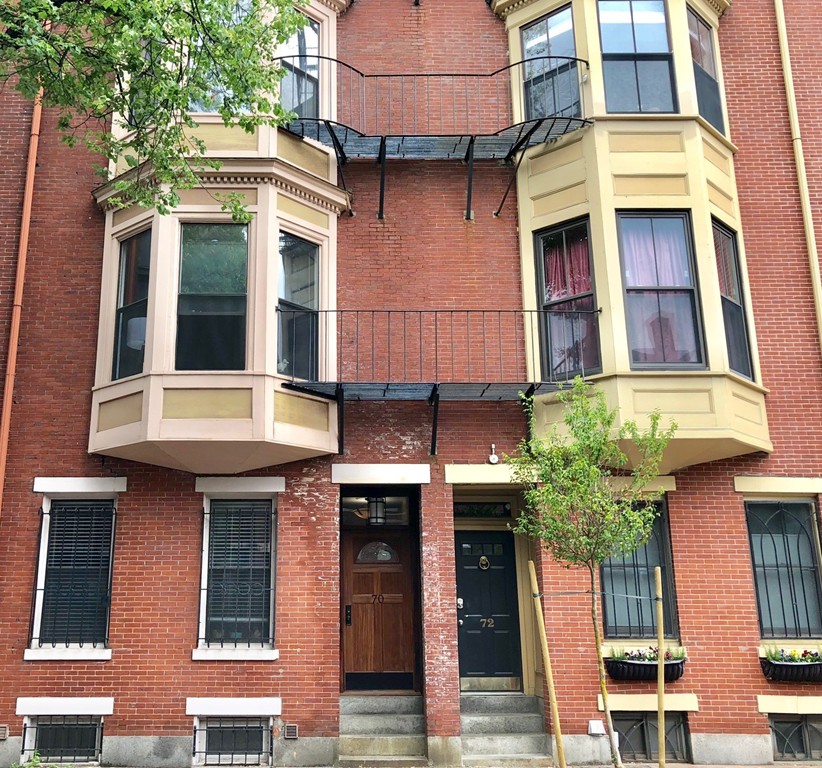 a front view of a multi story residential apartment building