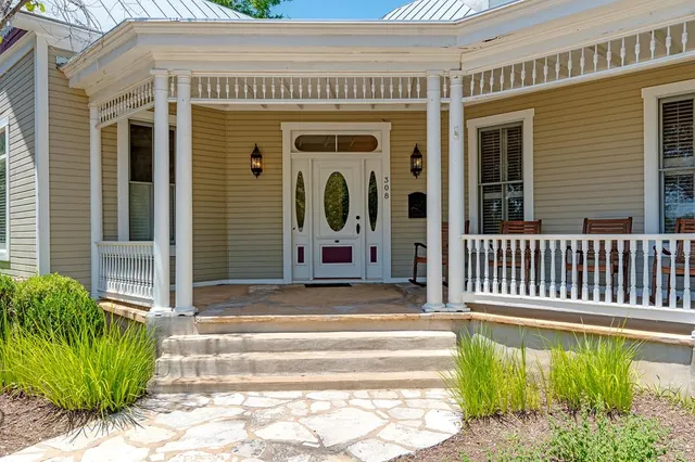 a view of a house with a small porch
