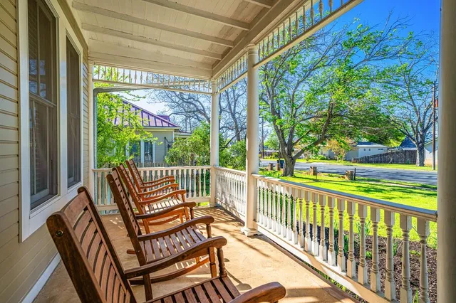 a view of a two chairs in the balcony