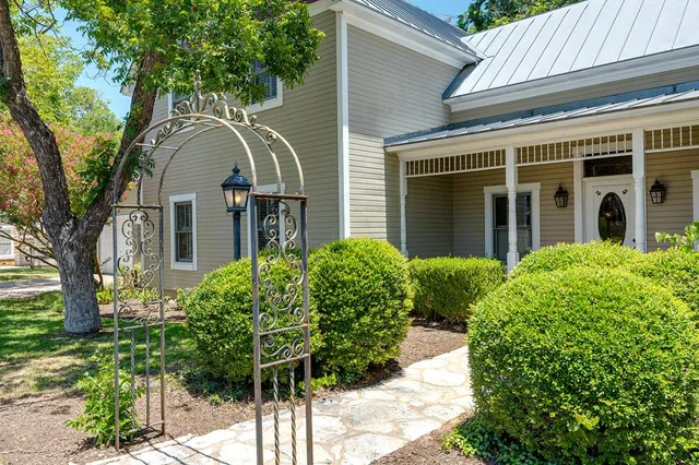front view of a house with a garden