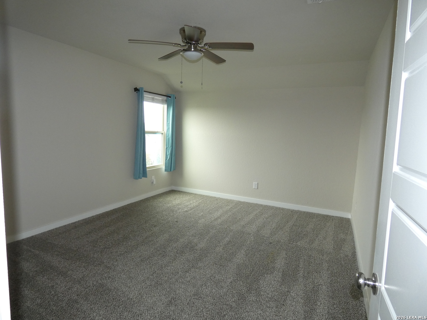 10503 Pablo Way Converse, TX 78109 - Photo 16 of 21 an empty room with a window and a fan