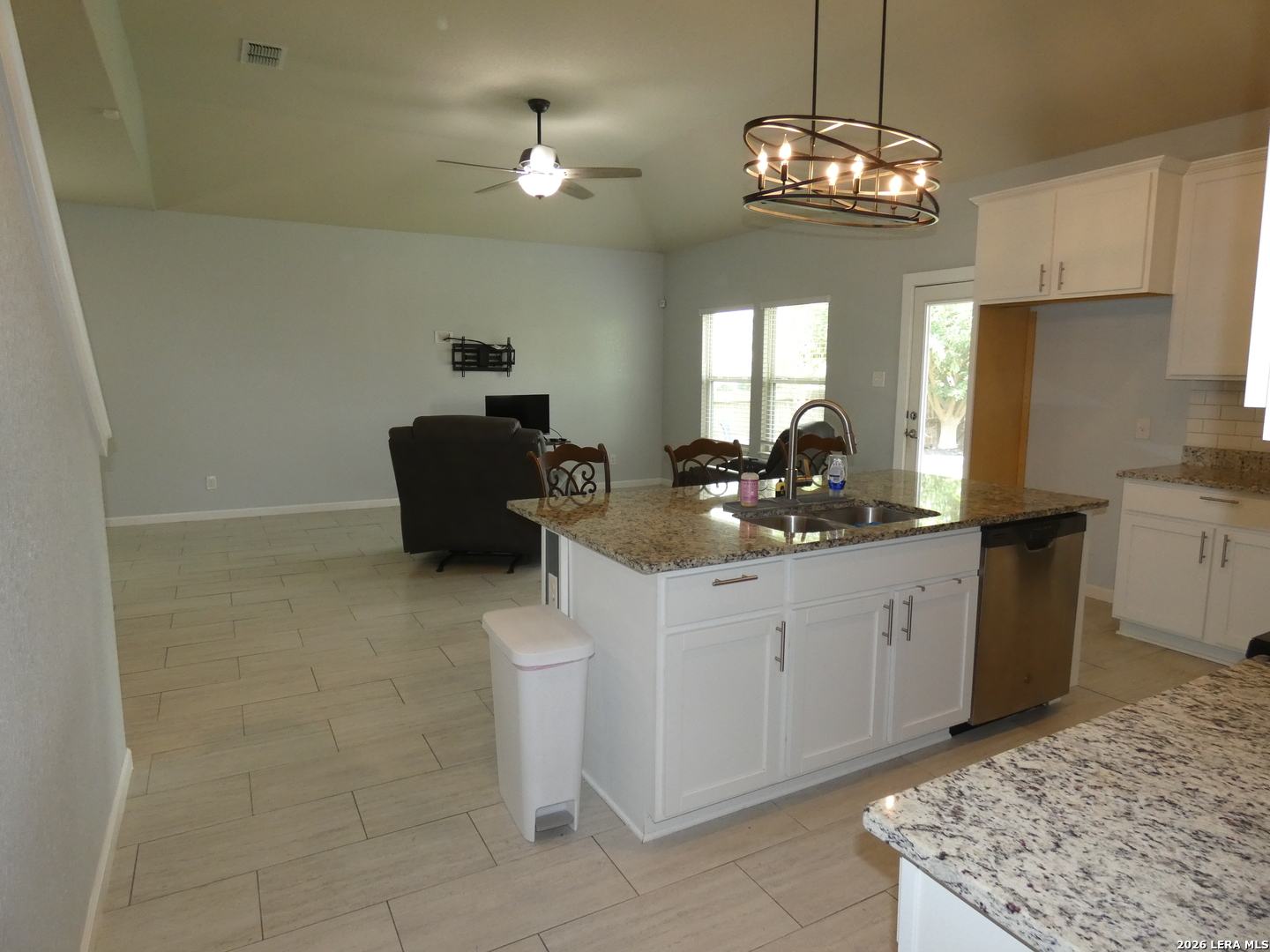 10503 Pablo Way Converse, TX 78109 - Photo 6 of 21 a kitchen with a sink a stove and cabinets