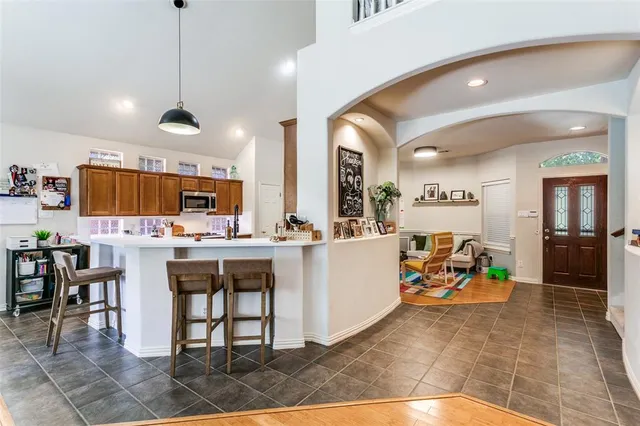 a view of a kitchen and dining area