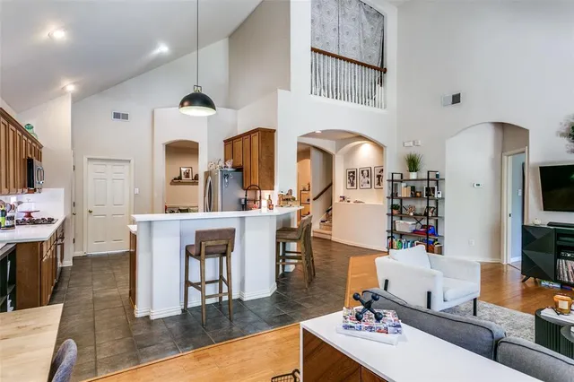 a living room with fireplace furniture and a flat screen tv