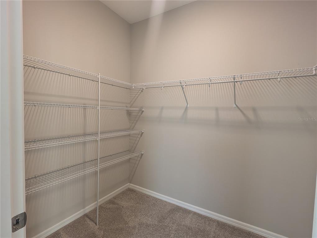 8545 Cache Drive Sarasota, FL 34240 - Photo 17 of 38 a view of a room with racks on the wall