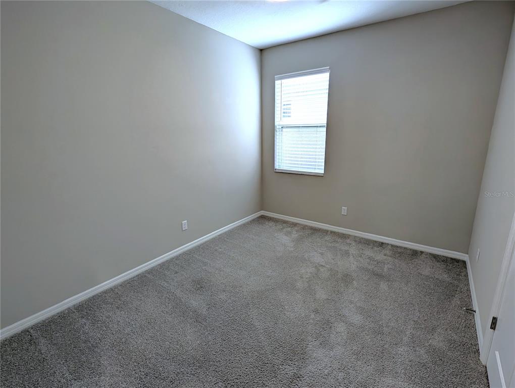 8545 Cache Drive Sarasota, FL 34240 - Photo 20 of 38 an empty room with a window