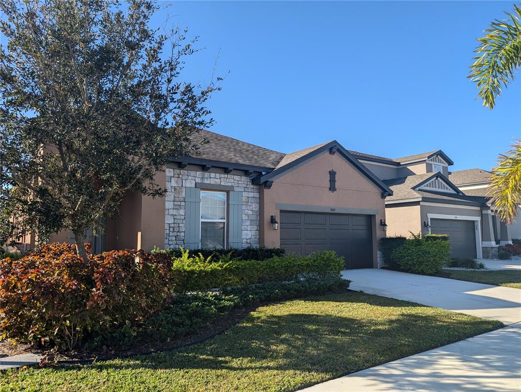 8545 Cache Drive Sarasota, FL 34240 - Photo 2 of 38 a front view of a house with a yard