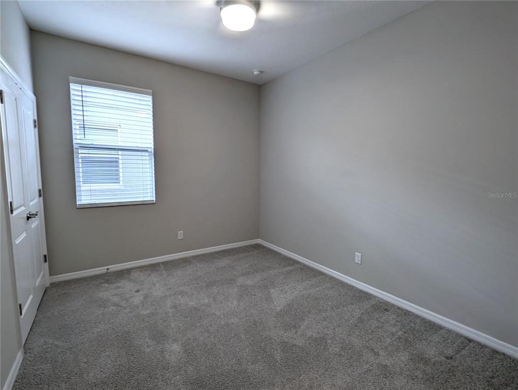 8545 Cache Drive Sarasota, FL 34240 - Photo 22 of 38 an empty room with a window