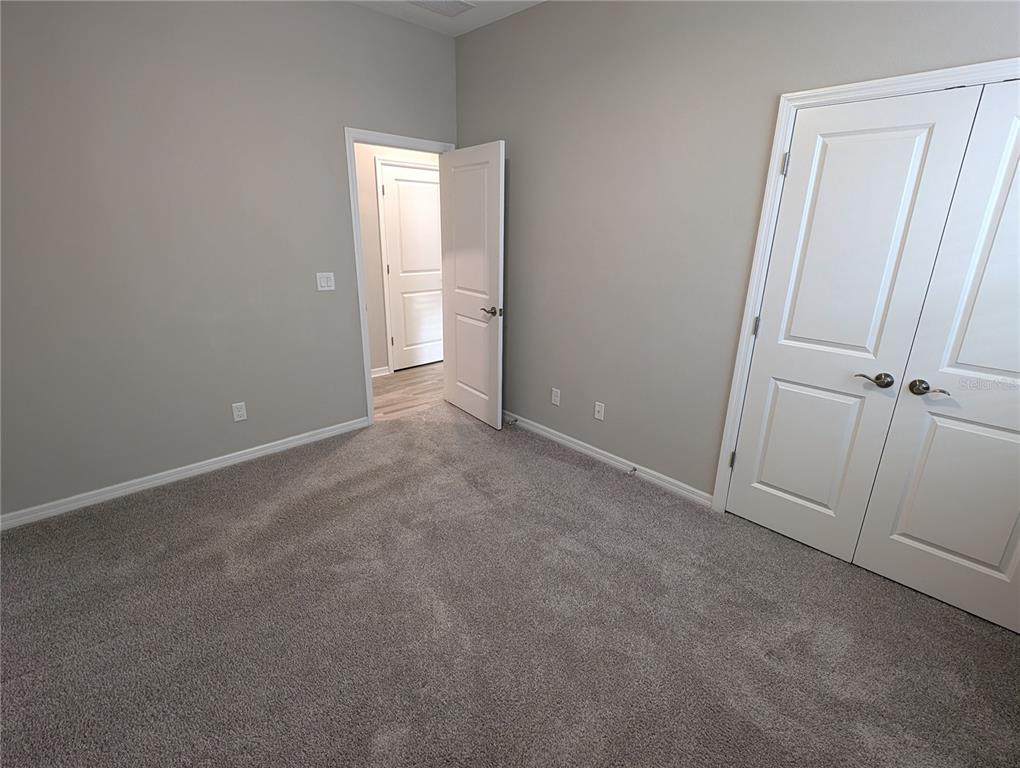 8545 Cache Drive Sarasota, FL 34240 - Photo 23 of 38 an empty room with windows
