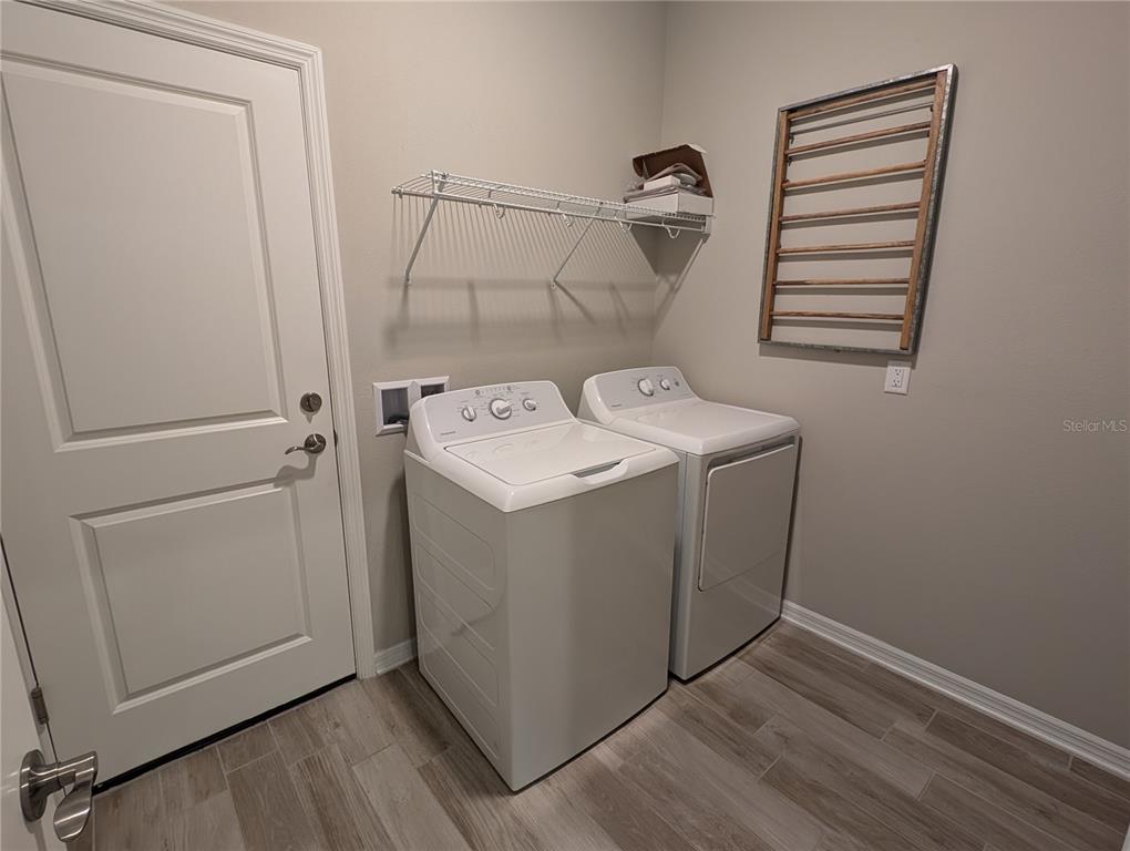 8545 Cache Drive Sarasota, FL 34240 - Photo 25 of 38 a utility room with dryer and washer
