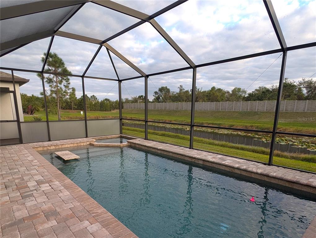 8545 Cache Drive Sarasota, FL 34240 - Photo 27 of 38 a view of outdoor space with a swimming pool