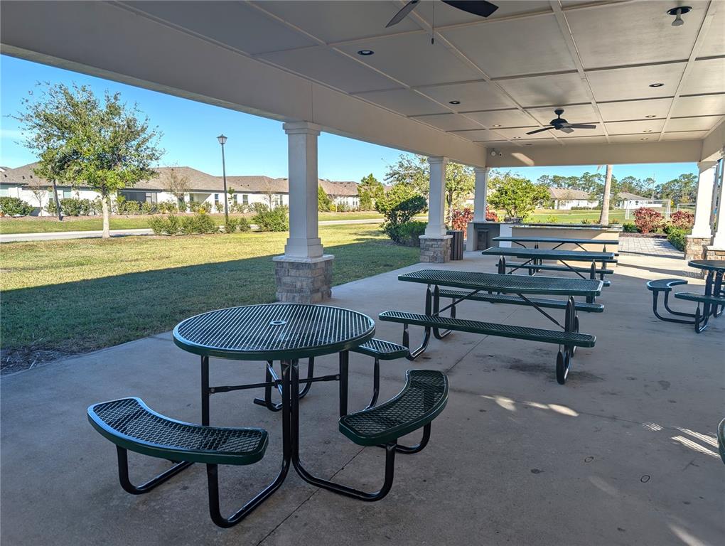 8545 Cache Drive Sarasota, FL 34240 - Photo 34 of 38 a view of a chairs and table in a patio