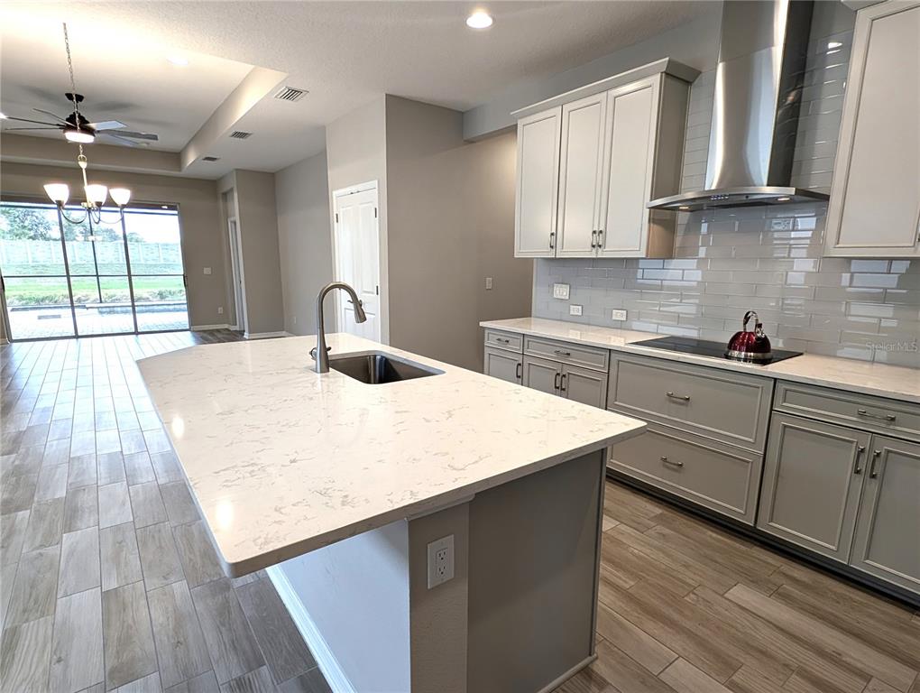 8545 Cache Drive Sarasota, FL 34240 - Photo 8 of 38 a kitchen with a sink a window and cabinets