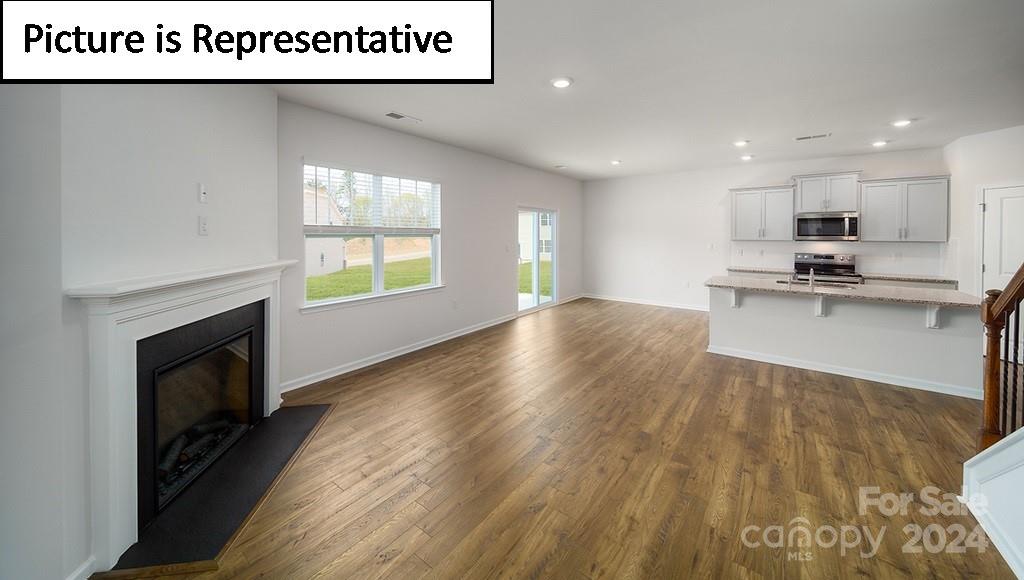 537 Stroupe Road Gastonia, NC 28056 - Photo 11 of 47 a view of kitchen with furniture wooden floor and window