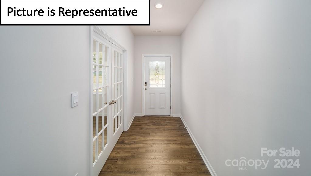 537 Stroupe Road Gastonia, NC 28056 - Photo 3 of 47 a view of a hallway with wooden floor