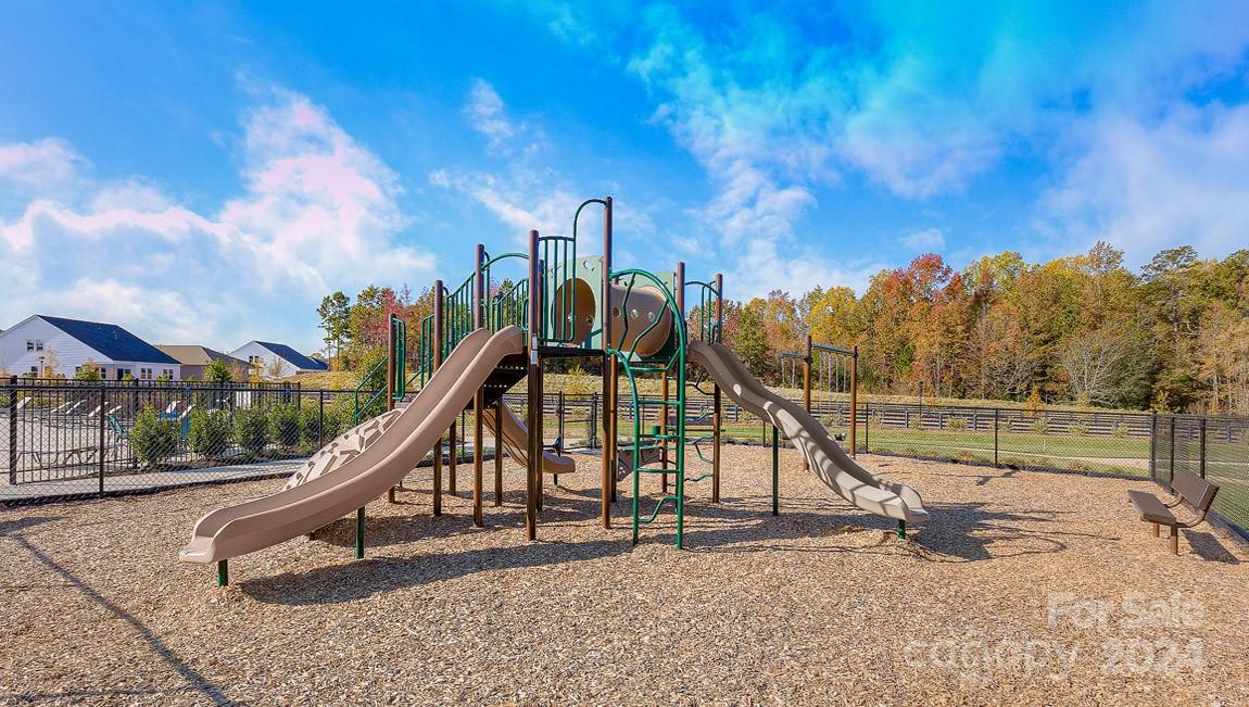 537 Stroupe Road Gastonia, NC 28056 - Photo 44 of 47 a view of a park with swings and slides