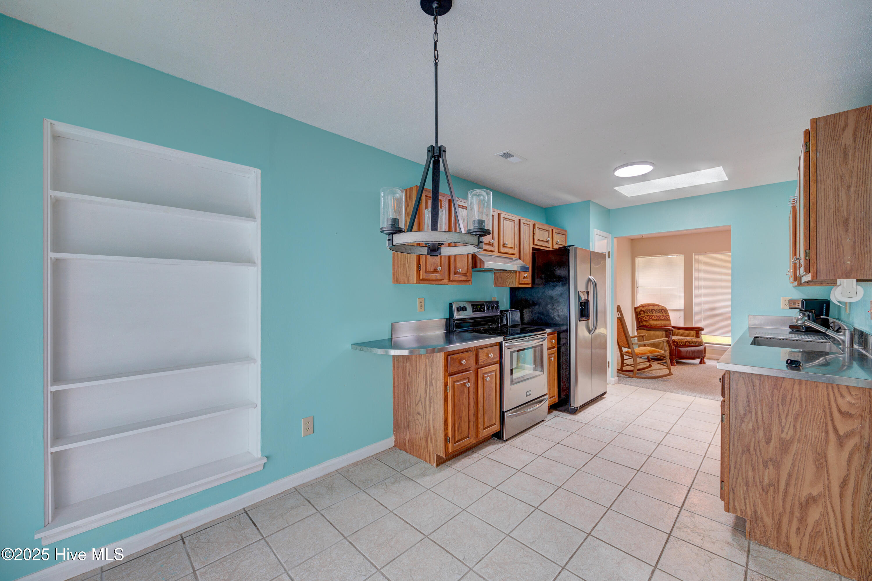103 Holly Tree Lane Hampstead, NC 28443 - Photo 18 of 36 Standing by breakfast nook