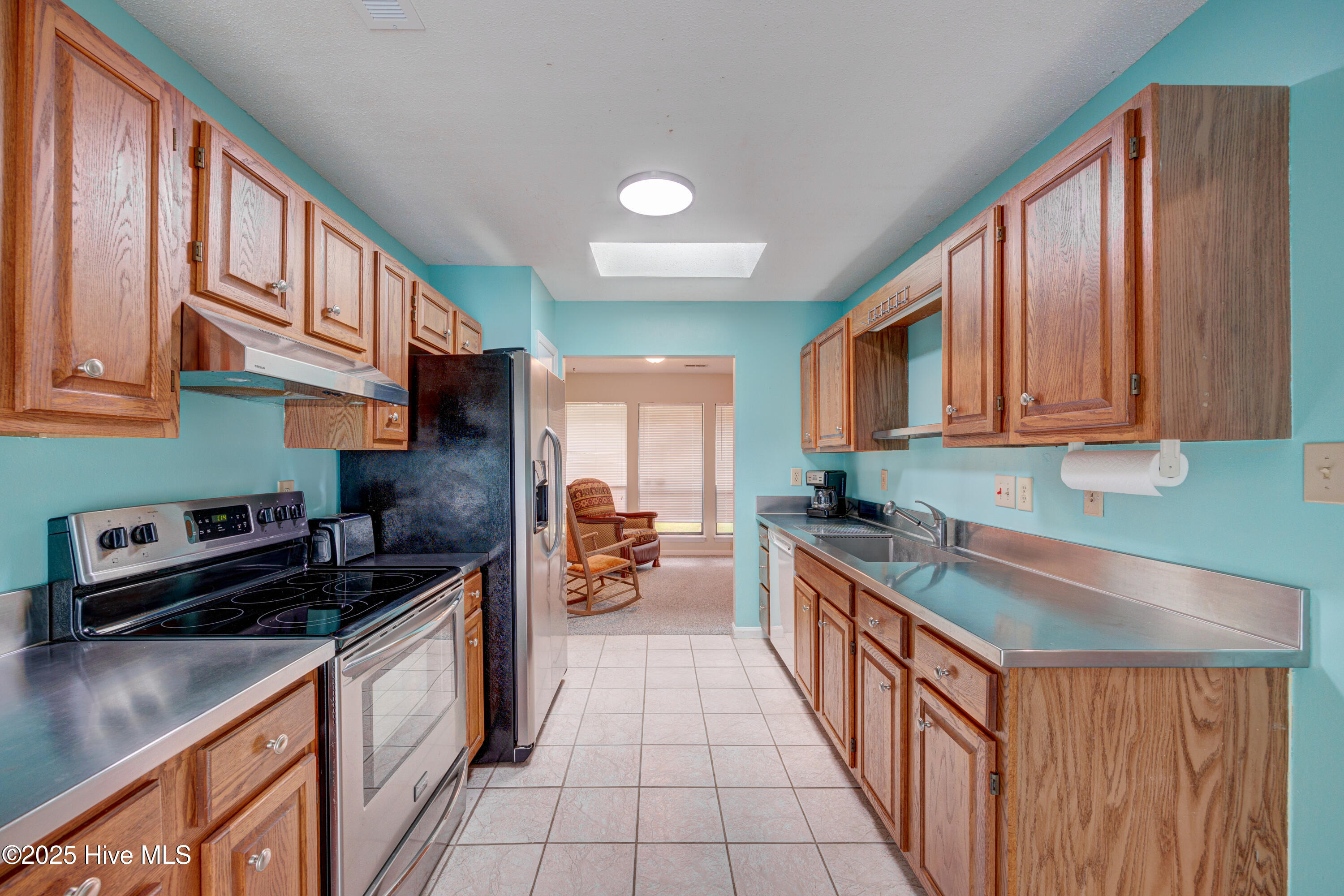 103 Holly Tree Lane Hampstead, NC 28443 - Photo 20 of 36 Breakfast Nook into Kitchen