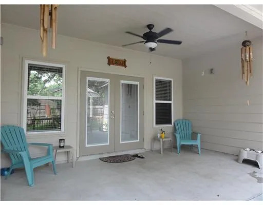 a view of living room with furniture and windows