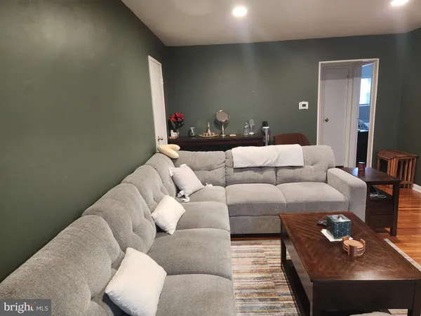 a living room with furniture and a rug