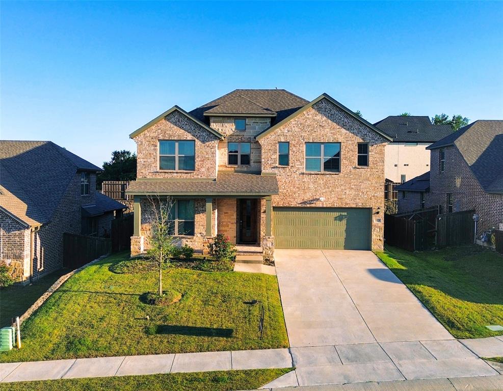 113 Nathan Drive Princeton, TX 75407 - Photo 1 of 40 a front view of a house with garden