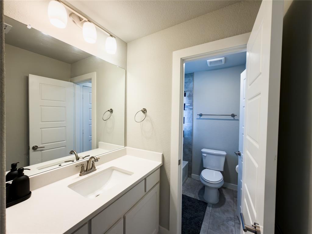 113 Nathan Drive Princeton, TX 75407 - Photo 30 of 40 a bathroom with a sink and a mirror