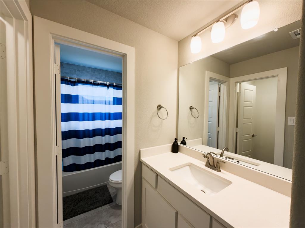 113 Nathan Drive Princeton, TX 75407 - Photo 31 of 40 a bathroom with a sink and a mirror