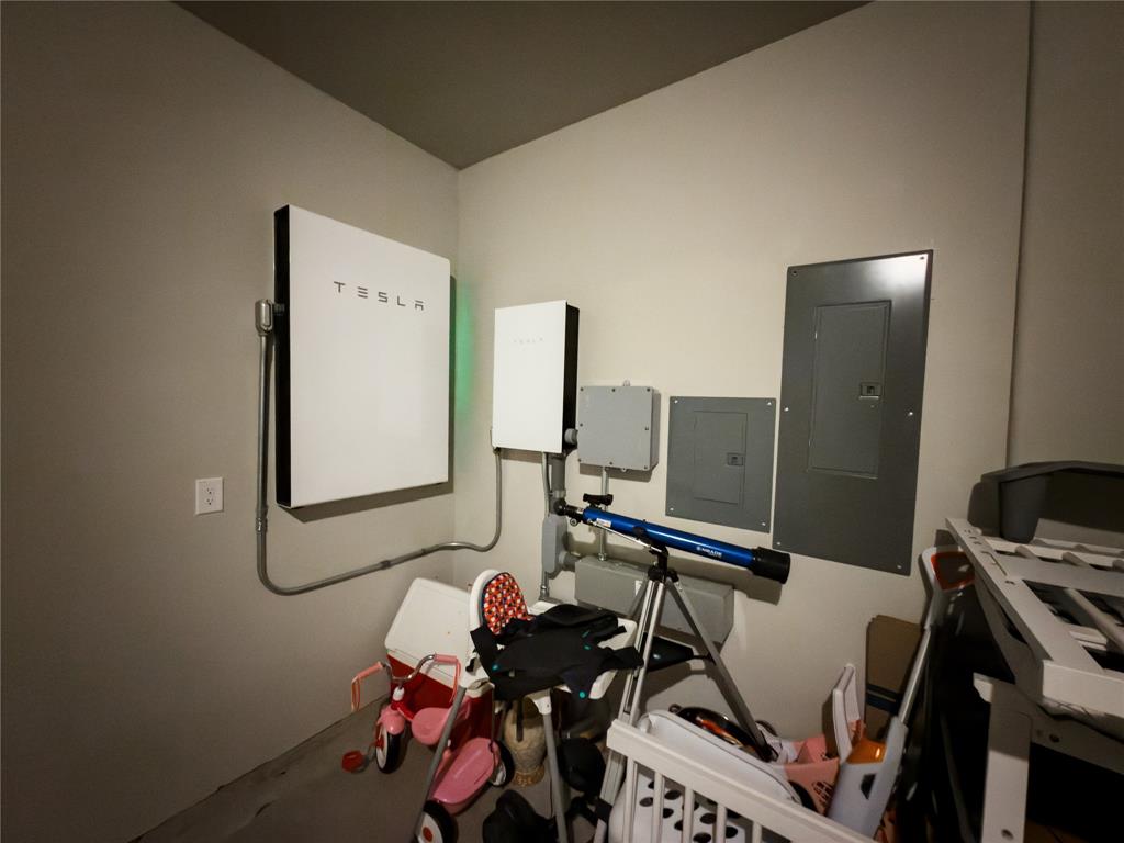 113 Nathan Drive Princeton, TX 75407 - Photo 34 of 40 a room with gym equipment and wooden floor
