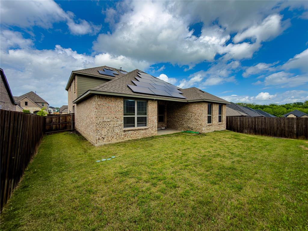 113 Nathan Drive Princeton, TX 75407 - Photo 36 of 40 a front view of a house with garden