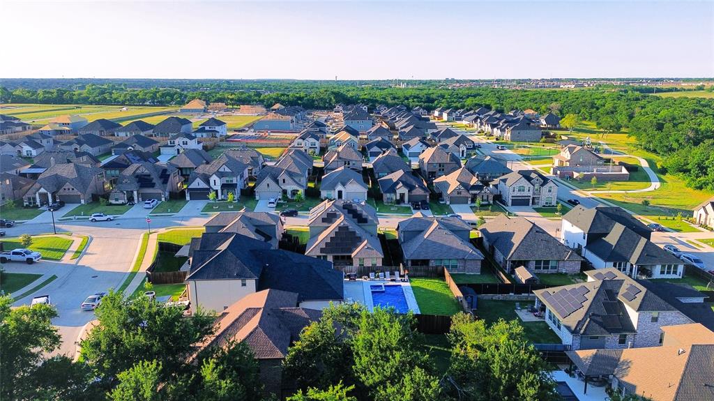 113 Nathan Drive Princeton, TX 75407 - Photo 37 of 40 an aerial view of residential houses with outdoor space and swimming pool